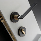 Sabaat Handle and Lock in black with gold knurled grip, combining luxury and function for high-end interior doors.