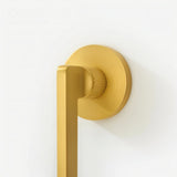 Close-up of Sabaat Handle in brushed gold with textured grip, emphasizing premium craftsmanship for interior doors.