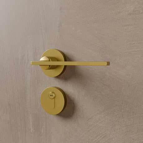 Sabaat Handle and Lock in brushed brass finish, featuring a sleek minimalist design ideal for modern interior doors.