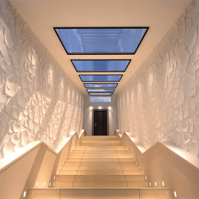 Sabit PVC Wall Panels lining a staircase with skylights, showcasing their waterproof and mold-proof 3D texture in a luxurious setting.