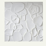Single white Sabit PVC Wall Panel with 3D abstract shapes, ideal for waterproof and mold-proof home wall decoration.