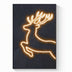Neon art print featuring a glowing golden deer silhouette leaping against a dark textured background.