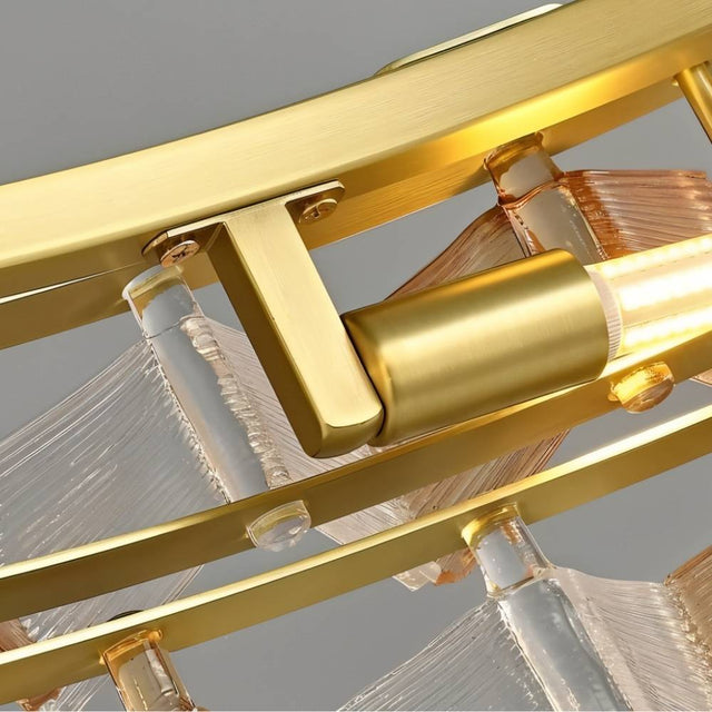 "Close-up of an iron Salane chandelier showing the intricate frame and layered amber glass elements."