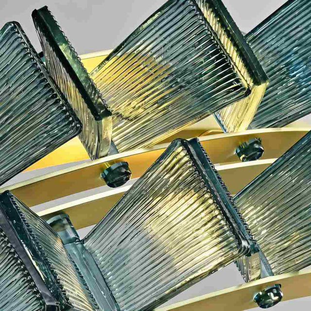 "Close-up of an iron Salane chandelier showing the textured blue glass elements and frame details."