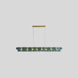 "Isolated iron Salane chandelier with layered blue glass elements, centered on a light grey background."