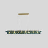 "Isolated iron Salane chandelier with layered blue glass elements on a light grey background."
