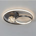 Modern black LED ceiling light with two illuminated rings and a crystal sphere accent on gray background.