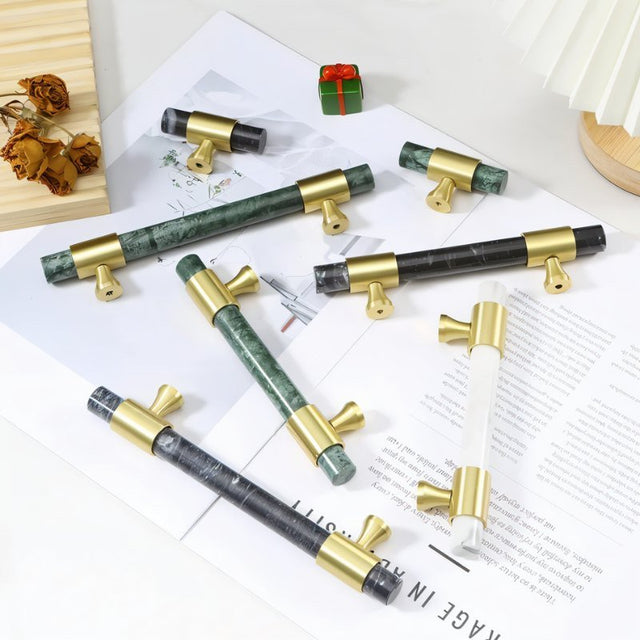 "Collection of luxurious marble handles with polished brass accents, showcasing various colors and designs suitable for contemporary and classic interiors."