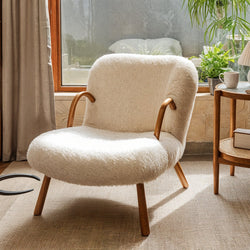 Sellan Contemporary Upholstered Accent Chair: This accent chair boasts clean lines, a sleek silhouette, and plush upholstery, offering modern style and comfort for any living space.