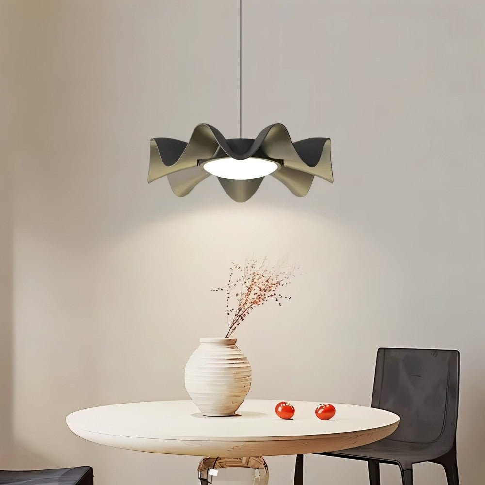 "Sculptural pendant light with a wave-like iron frame and acrylic diffuser creating a focal point in a modern living room."