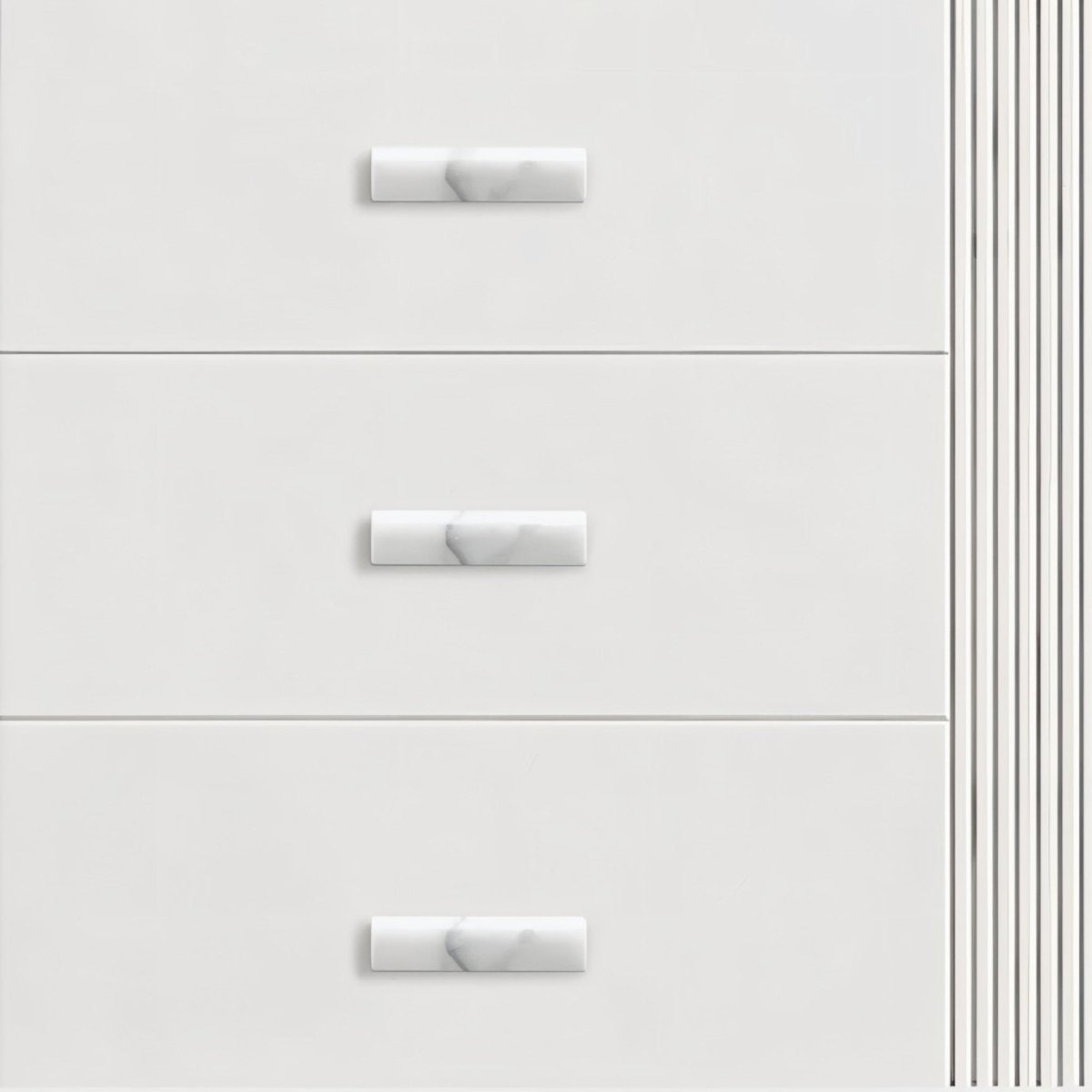 "Contemporary white drawers with sleek marble knobs, showcasing elegant hardware on furniture."