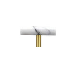 "A white marble knob with a polished brass stem, suitable for cabinets and drawers."
