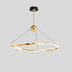 Gold curved pendant light with black ceiling canopy hanging against a gray background.