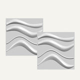 Close-up of Serfa Wall Panel showing two square PVC panels with raised wave patterns for stylish wall decoration.