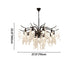 Black metal chandelier with cascading clear crystal strands, 27.5 inches wide, against white background.
