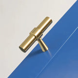 "Gold brass pull bar with cylindrical design and subtle accents, mounted on a blue surface."