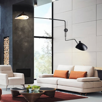 "Shifa Ceiling Lamp with adjustable arms and minimalist lampshades, made from aluminum, copper, and iron, providing modern lighting in a stylish living room with a sofa and coffee table."