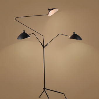 "Shifa floor lamp featuring adjustable angular arms and sleek cone-shaped shades, crafted from aluminum, copper, and iron, providing customizable lighting in modern interiors."