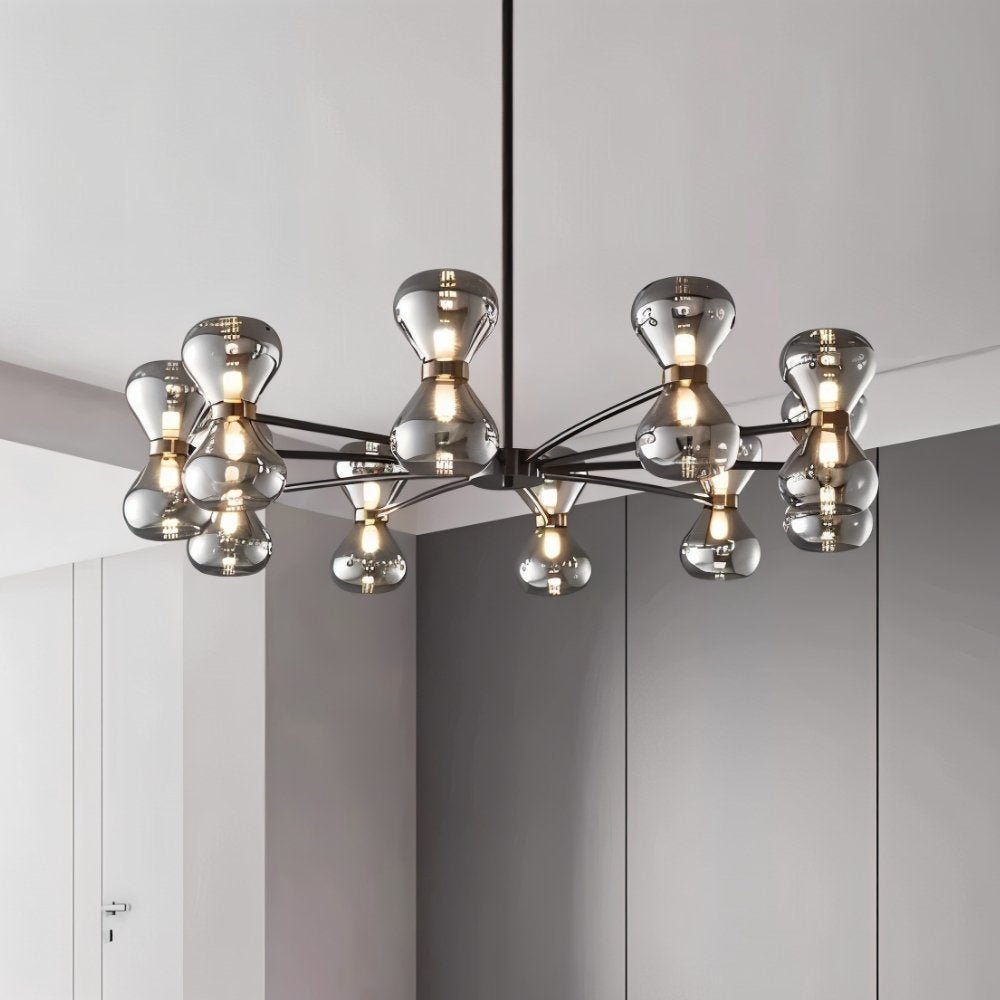 "Close-up of a black iron Silvine chandelier with smoked glass spherical shades, highlighting the geometric design."