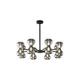 "Black iron Silvine chandelier with smoked glass spherical shades, isolated on a white background."