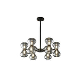 "Black iron Silvine chandelier with smoked glass spherical shades, isolated on a white background."