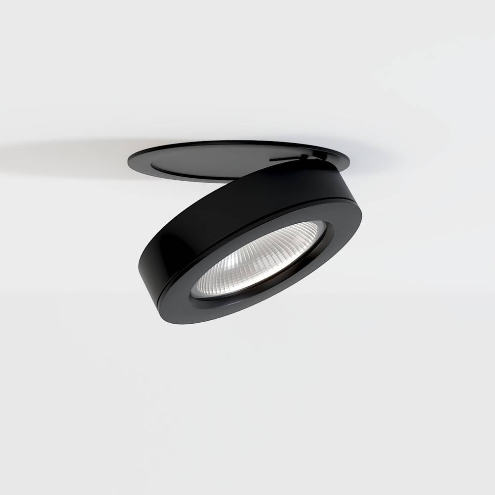 Black adjustable recessed downlight with LED lens mounted in white ceiling.