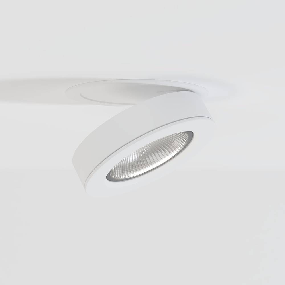 White adjustable downlight with ribbed reflector mounted on ceiling against white background.