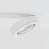 White recessed downlight with adjustable trim and reflective lens mounted on ceiling.