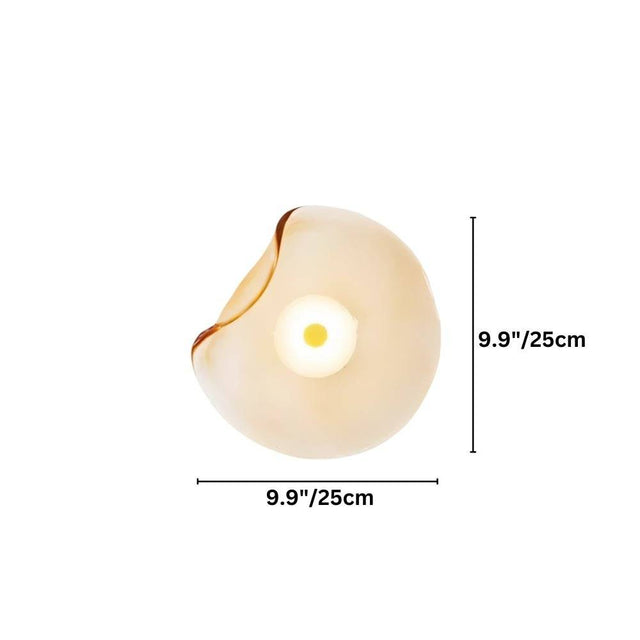 "A modern wall lamp with an amber, organically shaped glass shade and an iron base."