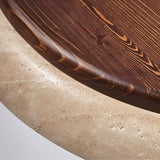 "Close-up of a minimalist ceiling light with a soft yellow travertine ring and acrylic diffuser, emitting a soft, even glow."