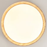 "Minimalist ceiling light with a soft yellow travertine ring and acrylic diffuser, isolated on a light gray background."