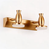 "A modern, 2-head vanity light in a brushed gold finish, showcasing its sleek design."