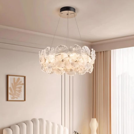 "A ring chandelier with handcrafted glass petals in a bedroom setting."