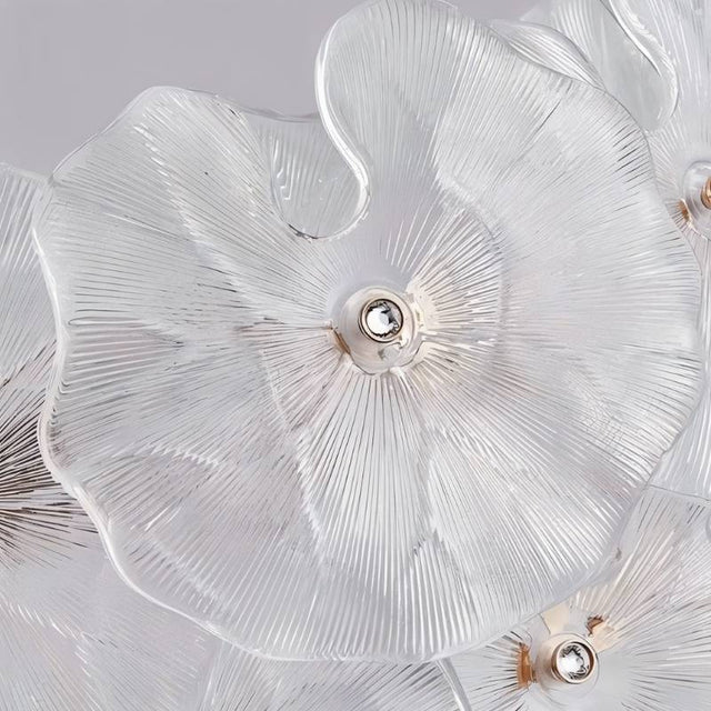 "A close-up of a chandelier with handcrafted glass petals."