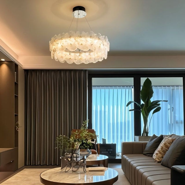 "A ring chandelier with handcrafted glass petals in a contemporary living room."