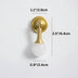 Brass and white crystal knob with mounting hardware displayed against a white background.