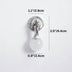 Chrome single-light wall sconce with frosted glass globe shade, mounted on white wall.