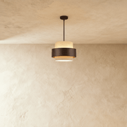 Two-tier pendant light with speckled and ribbed texture, cylindrical shade, brushed metal canopy, studio white background, fr