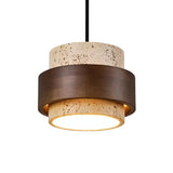 "A modern cylindrical pendant light featuring natural stone and dark wood, isolated on a white background."