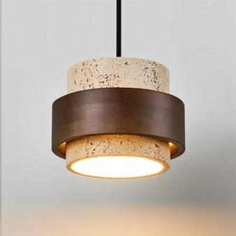  "A modern cylindrical pendant light featuring natural stone and dark wood, hanging against a light background."