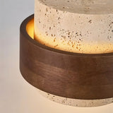 "Detailed view of a modern pendant light showcasing the texture of natural stone and dark wood."