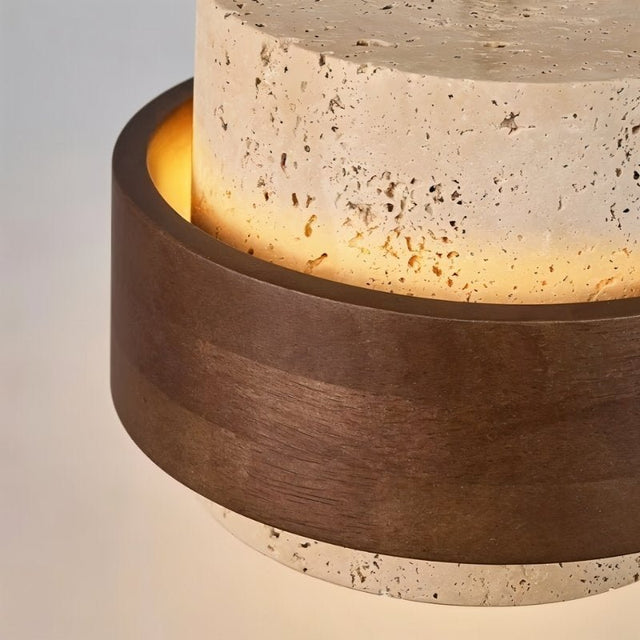 "Detailed view of a modern pendant light showcasing the texture of natural stone and dark wood."
