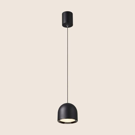 Black Sterna Pendant Light with a dome-shaped aluminum fixture and adjustable cord, shown on a beige background.