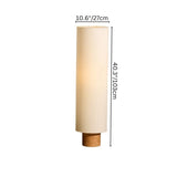 "Svetlina floor lamp showing dimensions: 10.6 inches (27 cm) width and 40.3 inches (103 cm) height, with a cylindrical fabric lampshade and wood base."