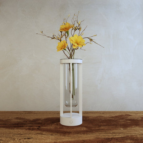Svetu Waterproof Rechargeable Pendant Table Lamp in white with yellow flowers, placed on a rustic wooden surface for ambient indoor lighting.