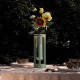 Green Svetu Waterproof Rechargeable Pendant Table Lamp on an outdoor dining table, enhancing evening ambiance with LED lighting and floral arrangement.