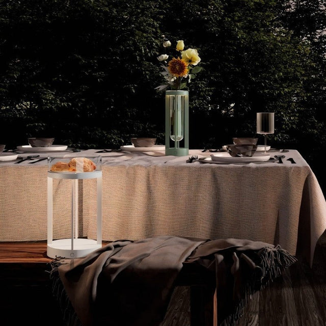 Outdoor dining setup with two Svetu Waterproof Rechargeable Pendant Table Lamps in white and green, ideal for ambient lighting and decor.