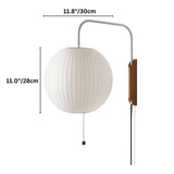 "A modern, minimalist wall lamp with a luxurious silk shade emitting a soft, warm glow."
