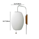 "A stylish, contemporary wall lamp featuring a luxurious silk shade for a soft, ambient light."