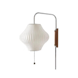 "A modern wall lamp with a luxurious silk shade, creating a warm and elegant ambiance."